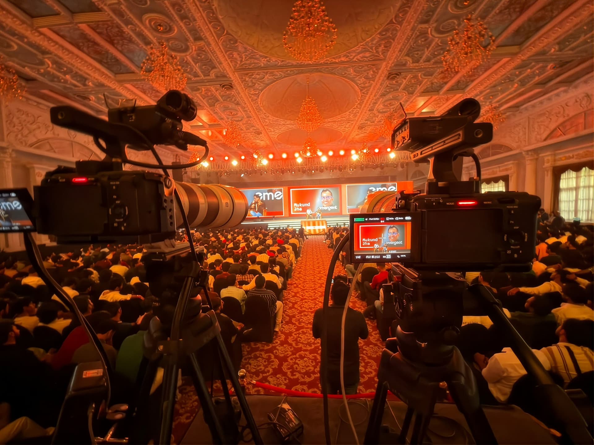 Two cameras rigged on the main stage at Startup School